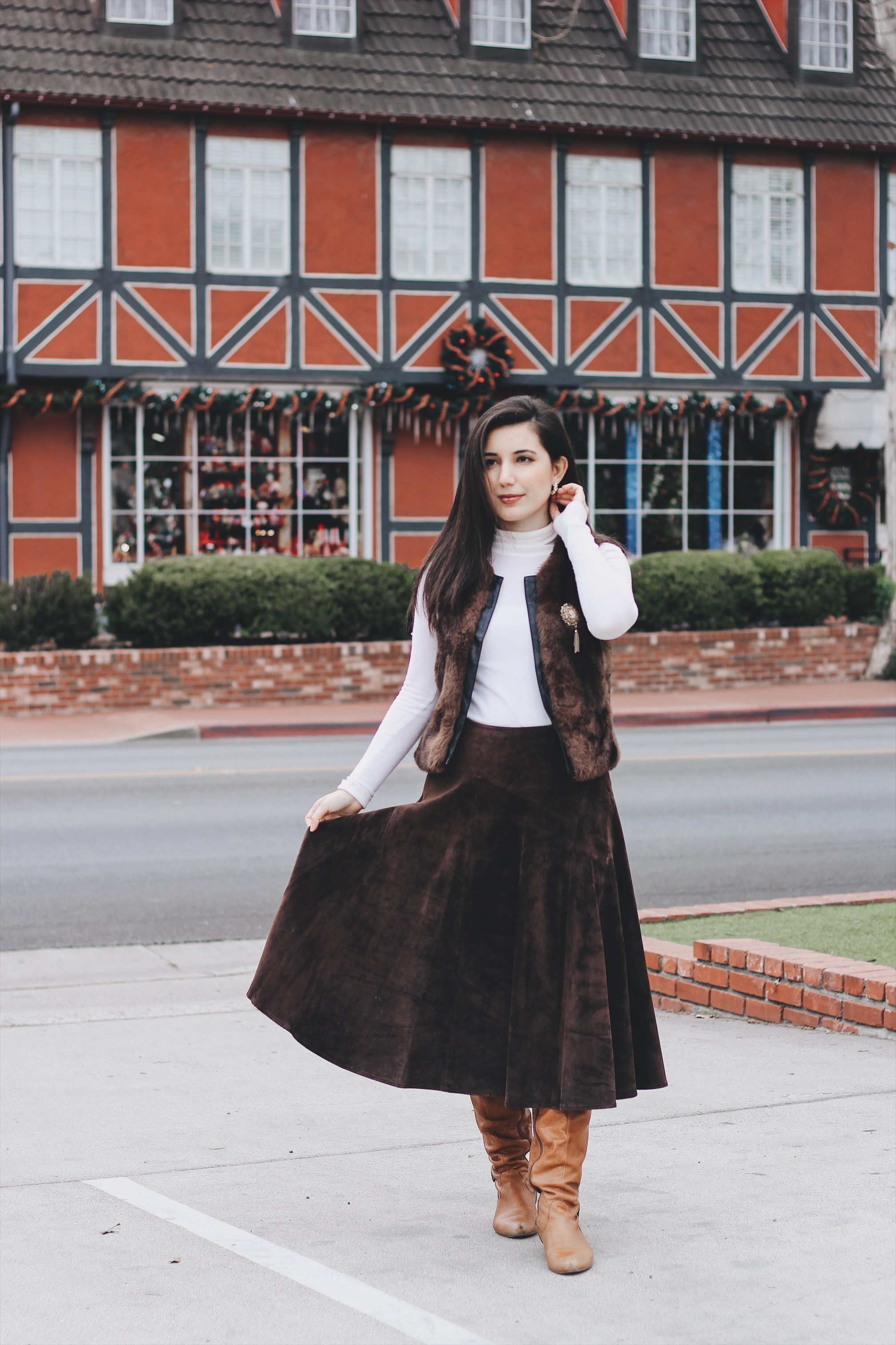 Solvang, CA, ALDO boots, fur vest, ootd, outfit of the day, California, CA, suede skirt, Jones New York, cameo brooch, white turtleneck, European, European outfit, lookbook, fashion blogger, travel