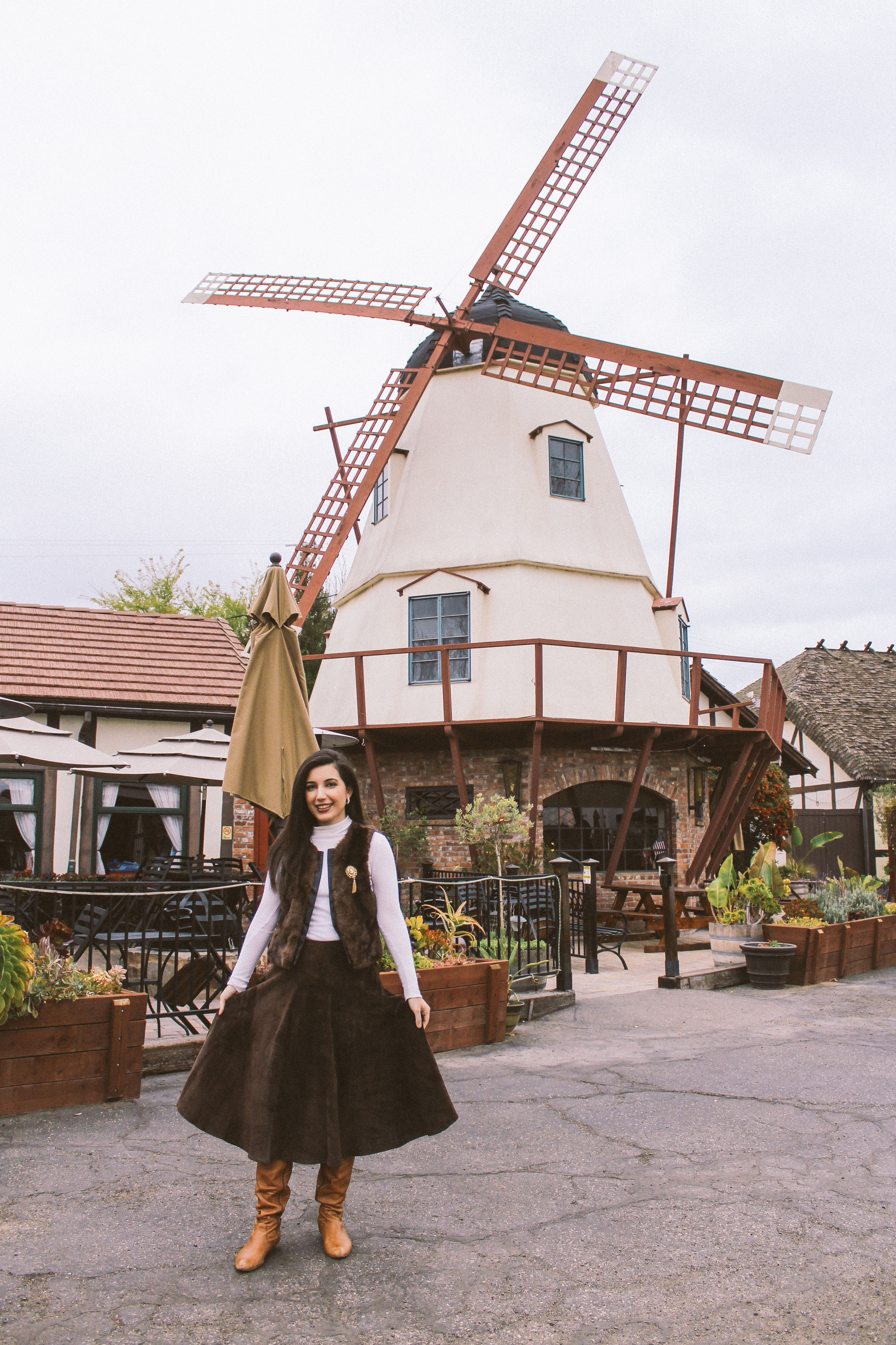 Solvang, CA, ALDO boots, fur vest, ootd, outfit of the day, California, CA, suede skirt, Jones New York, cameo brooch, white turtleneck, European, European outfit, lookbook, fashion blogger, travel