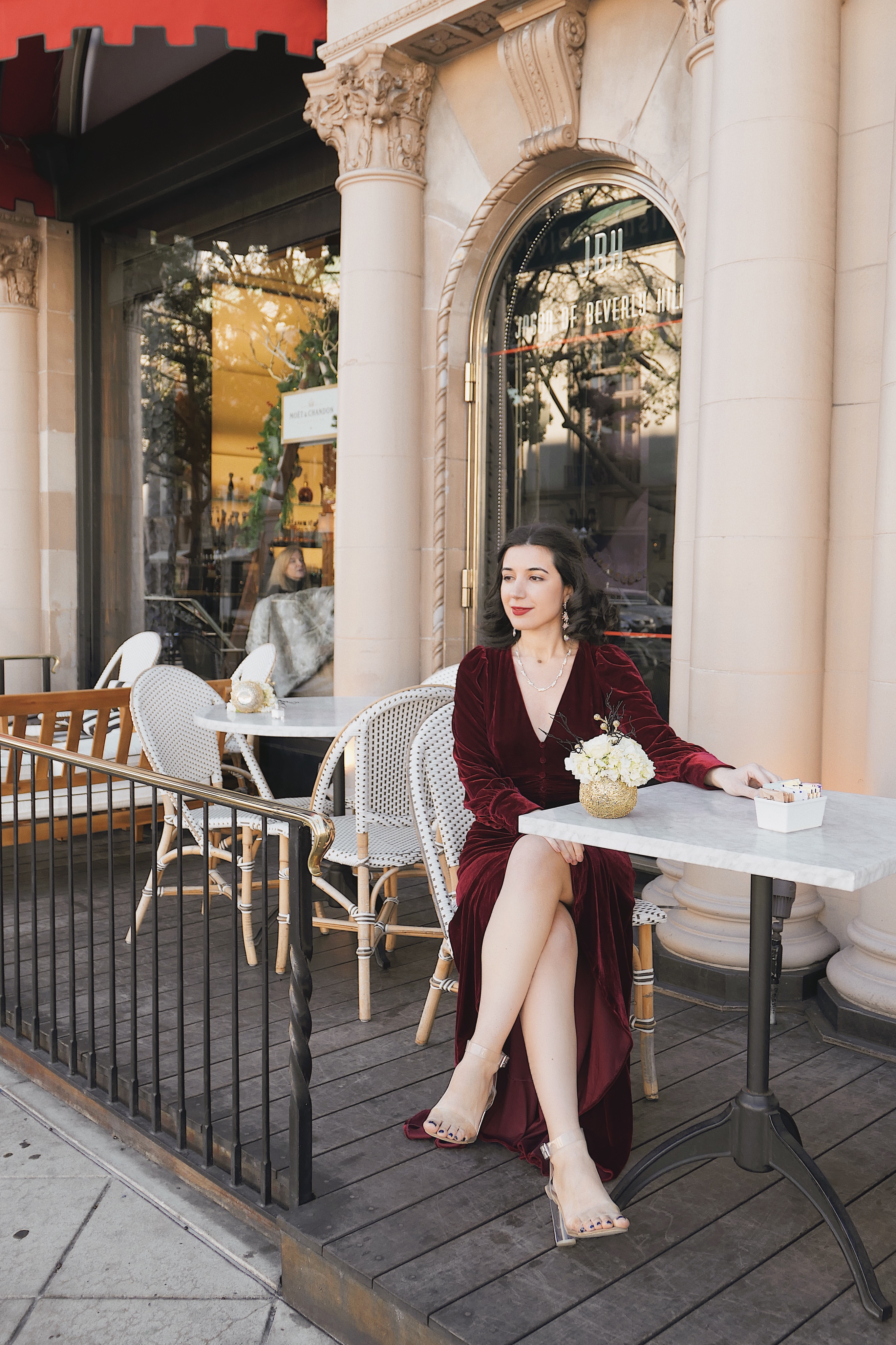 The Beverly Wilshire, red velvet, Christmas dress, Christmas outfit, gown, red velvet, fashion blogger, LA blogger, Beverly Hills, Christmas in Beverly Hills, Christmas in Los Angeles, high fashion, luxury, Edwardian, vintage, rhinestone necklace, rhinestone earrings, Nanamacs, Jeffrey Campbell shoes, curly hair, red lips