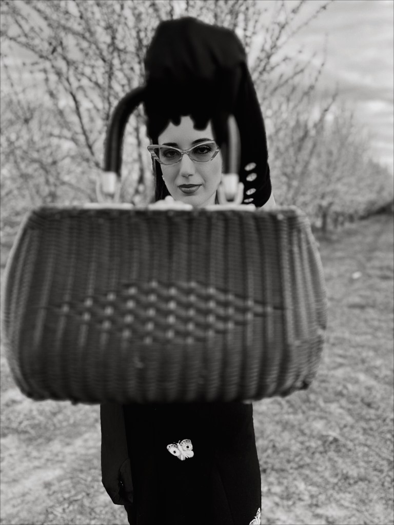 Autumn Adeigbo, knitwear, crop top, butterfly top, vintage earrings, opera gloves, spring 2023 fashion trends, fashion month, couture week, Paris fashion week, Milan fashion week, runway, wicker bag, vintage purse, suede boots