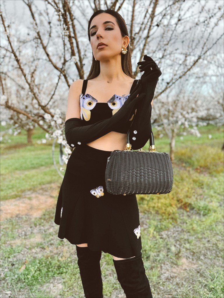 Autumn Adeigbo, knitwear, crop top, butterfly top, vintage earrings, opera gloves, spring 2023 fashion trends, fashion month, couture week, Paris fashion week, Milan fashion week, runway, wicker bag, vintage purse, suede boots