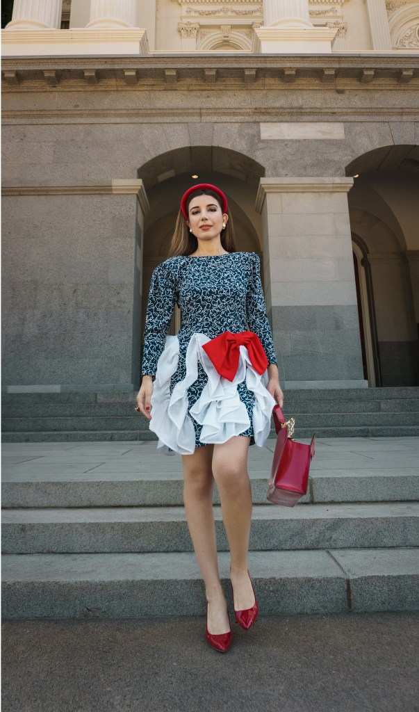 This red, blue and white dress was my mom's prom dress in the late 80s. She designed it and my grandma custom made it for her, with puffy sleeves, a big bow, and three-dimensional chiffon adornments. I wore it with a puffy headband, some red pumps, and an architectural red bag. I'm wearing it in front of the California State Capitol in Sacramento.
