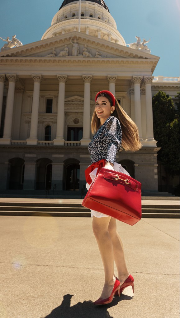 This red, blue and white dress was my mom's prom dress in the late 80s. She designed it and my grandma custom made it for her, with puffy sleeves, a big bow, and three-dimensional chiffon adornments. I wore it with a puffy headband, some red pumps, and an architectural red bag. I'm wearing it in front of the California State Capitol in Sacramento.