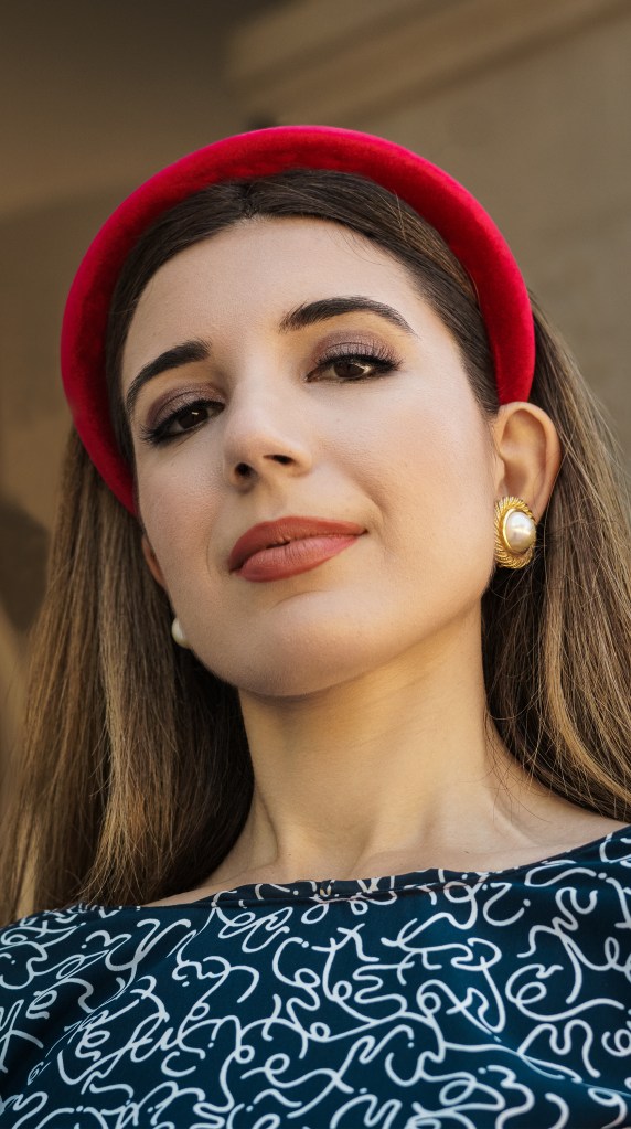 This red, blue and white dress was my mom's prom dress in the late 80s. She designed it and my grandma custom made it for her, with puffy sleeves, a big bow, and three-dimensional chiffon adornments. I wore it with a puffy headband, some red pumps, and an architectural red bag. I'm wearing it in front of the California State Capitol in Sacramento.